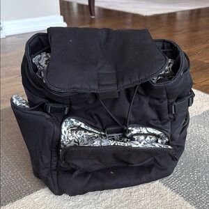 Black Backpack with Sturdy Fabric and Multiple Compartments
